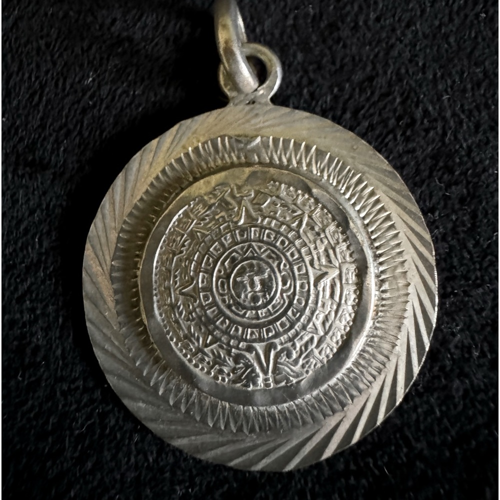 Sterling silver, round pendant